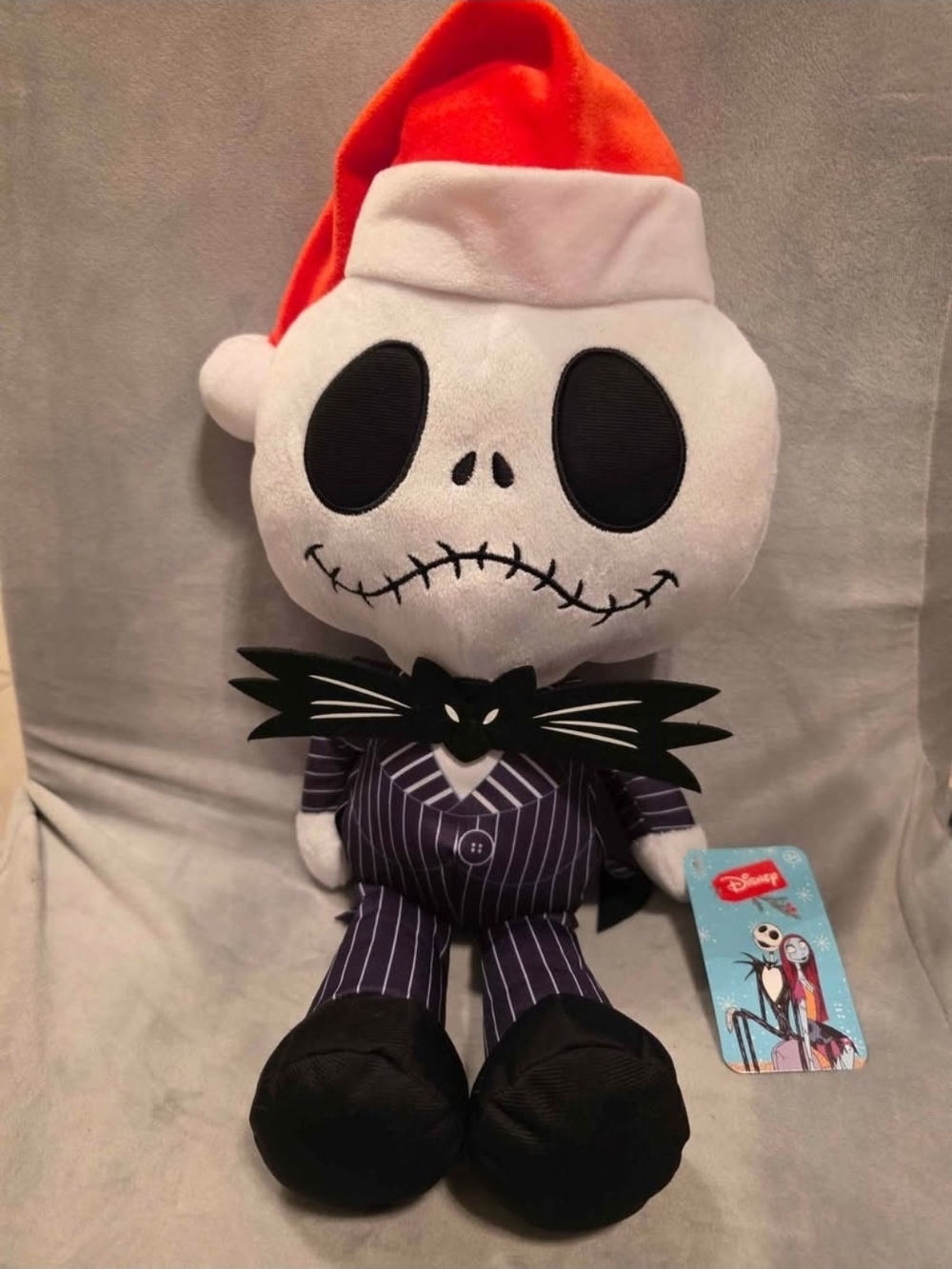Jack Skellington from Disney's The Nightmare Before Christmas, dressed in a Sant